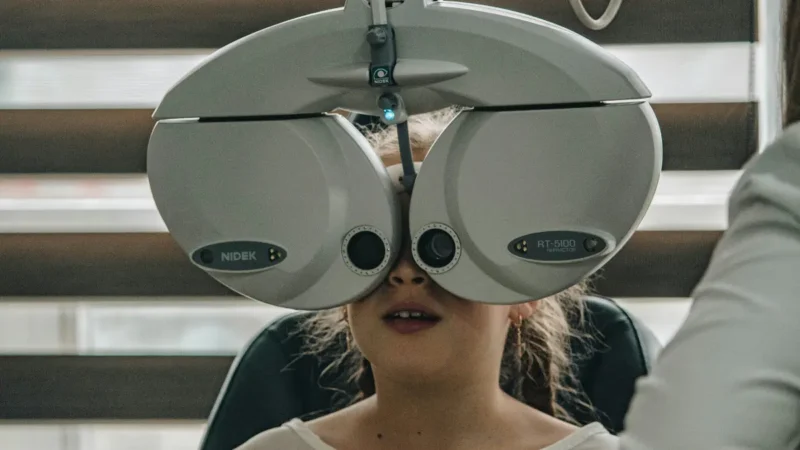 Eye exam illustration showing comprehensive vision tests by an optometrist
