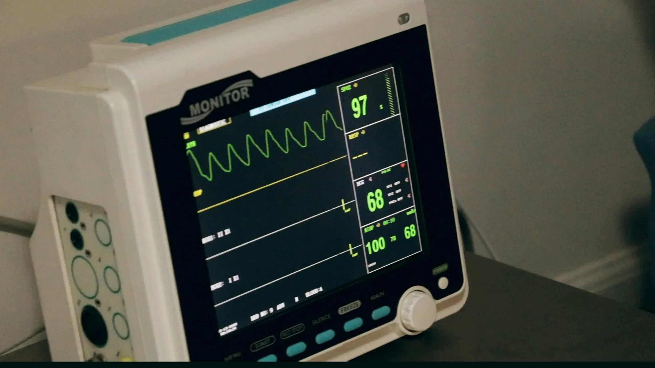 Medical professional using heart rate zones monitor while exercising with digital display showing 5 training zone ranges