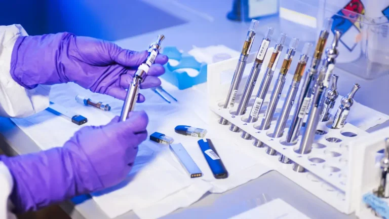 Laboratory scientist handling diagnostic equipment and preparing samples for Anti-dsDNA Test analysis.