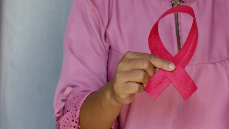 Cervical Cancer Symptoms awareness symbol showing pink ribbon for women’s health