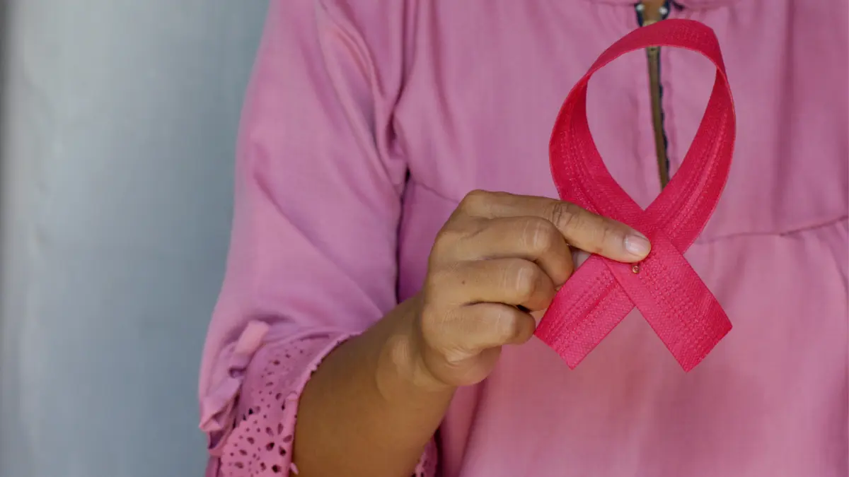 Cervical Cancer Symptoms awareness symbol showing pink ribbon for women’s health