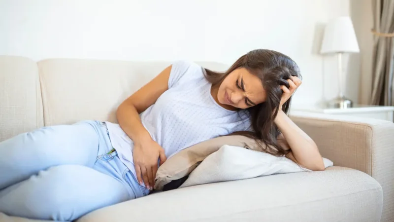Endometrial Cancer warning sign showing postmenopausal pelvic pain and discomfort