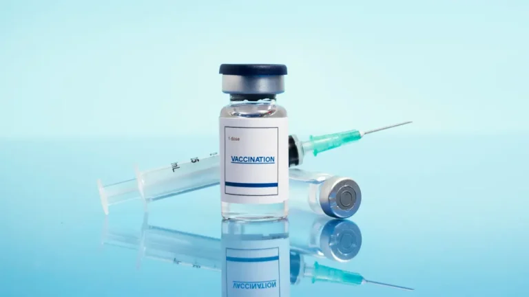 H3N2 Flu Vaccine, Tamiflu shown with vaccine vial and syringe representing reduced vaccine effectiveness and antiviral treatment importance