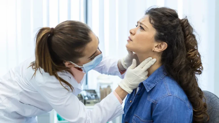 Thyroid Cancer examination showing doctor checking neck for thyroid lump