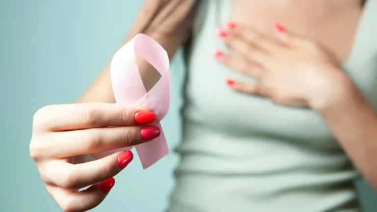 Breast cancer awareness woman holding pink ribbon for early detection and support