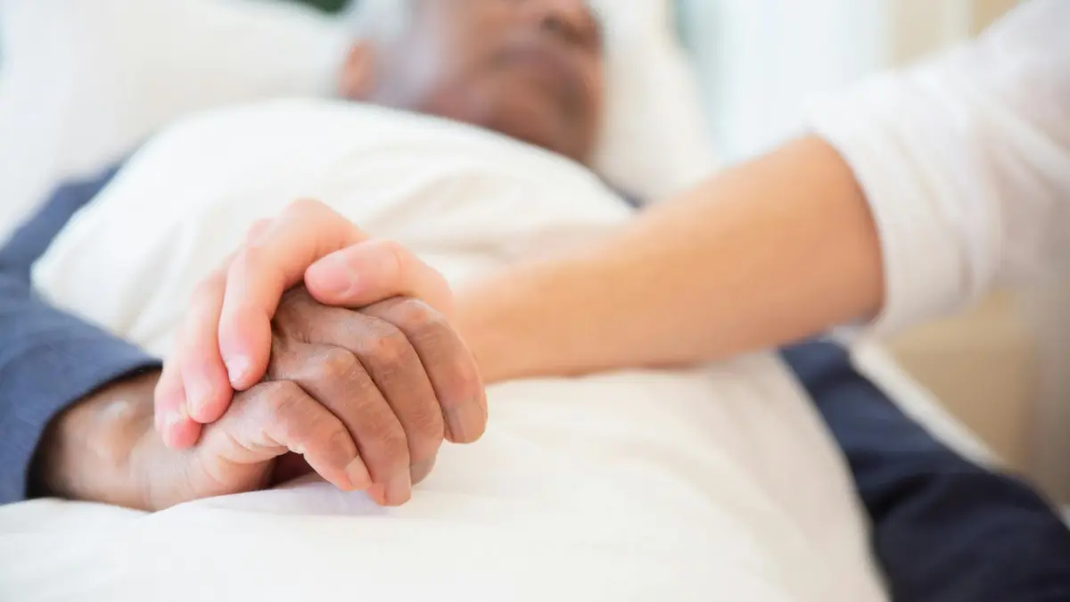 lung cancer palliative care caregiver providing home support for patient symptom management