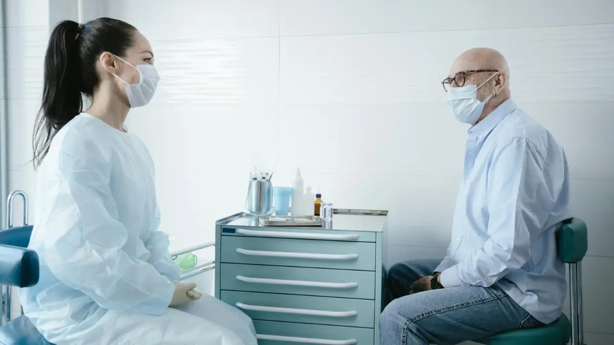Lung Cancer Screening — senior patient having a face-to-face clinical consultation with a physician to confirm LDCT eligibility and complete the shared decision-making visit required by Medicare