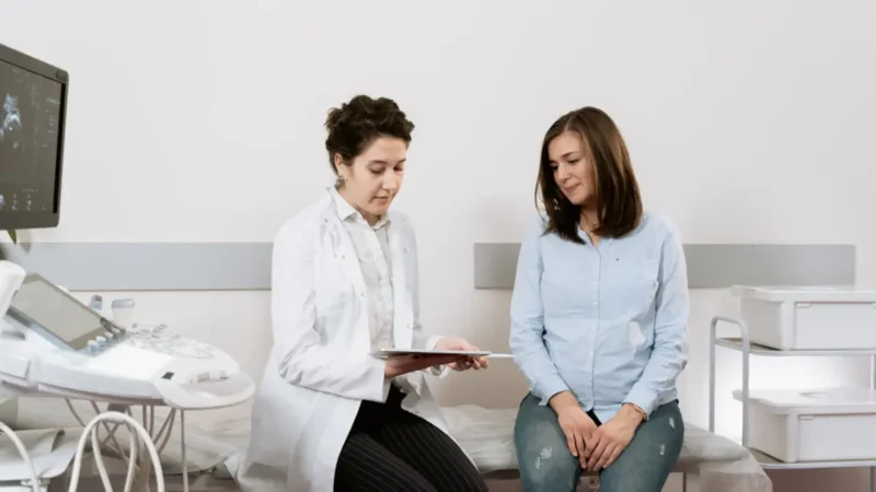 Metastatic Breast Cancer patient discussing treatment options with an oncology specialist in a modern clinic