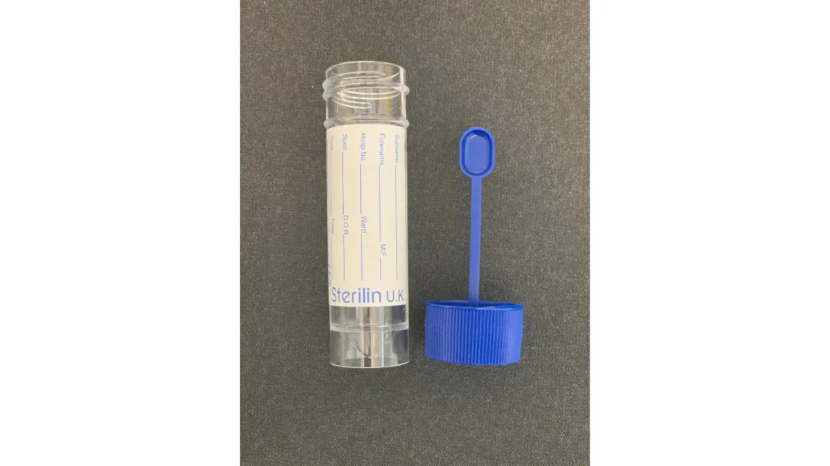Cologuard stool sample collection container with integrated spoon/scraper for at-home colorectal cancer screening kit.