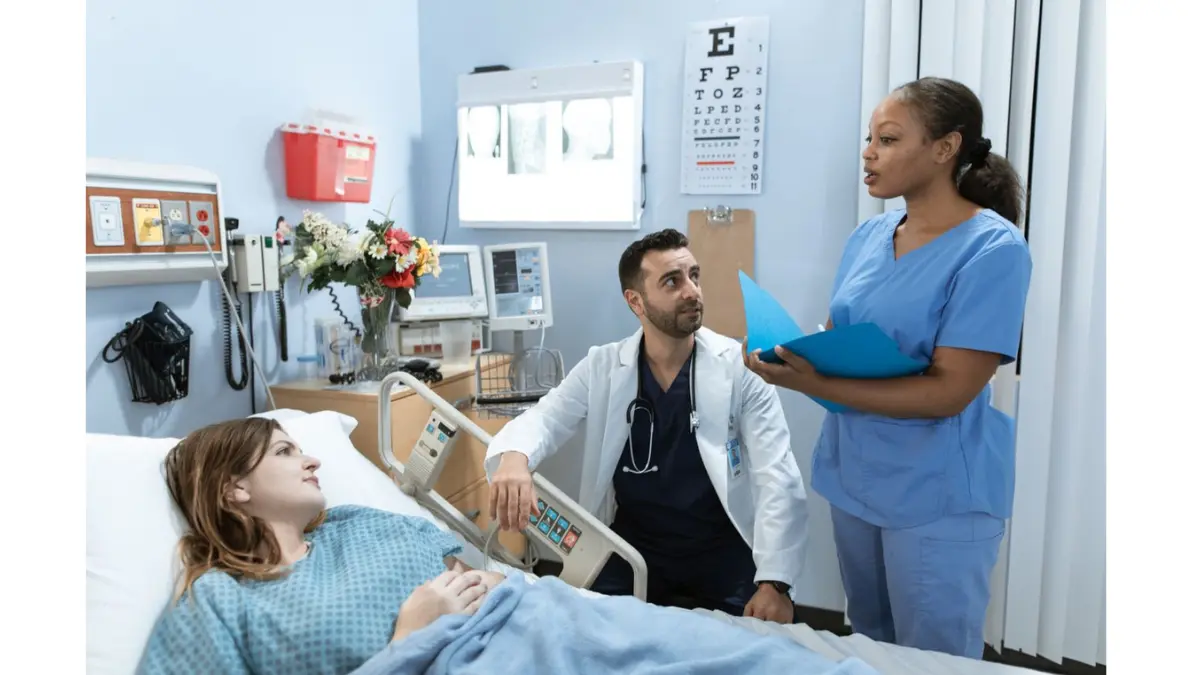 Colonoscopy Take day-of timeline showing a patient in a hospital bed with an IV line and medical staff preparing for the procedure.