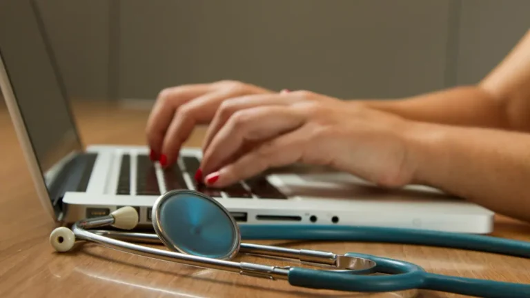 Healthcare provider coordinating specialized data entry for patient genetic and biomarker testing.