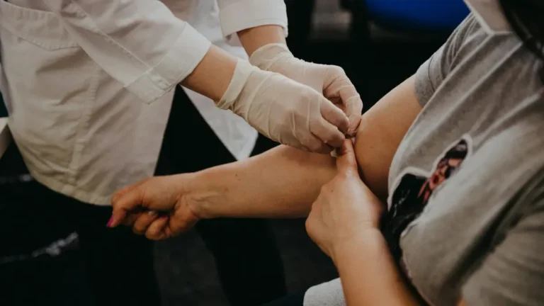 Healthcare professional drawing blood for a Shield Blood Test to screen for colon cancer.