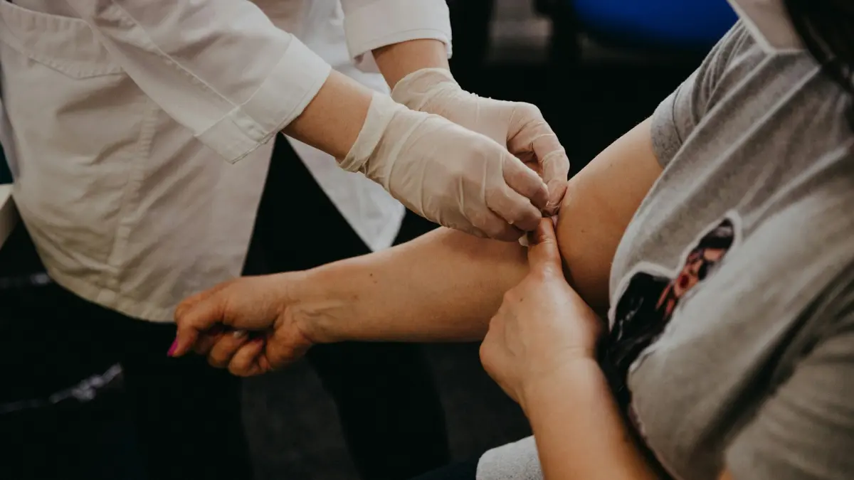 Healthcare professional drawing blood for a Shield Blood Test to screen for colon cancer.