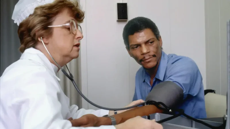 A clinical discussion between a physician and a patient reviewing metabolic profiles to understand if a CMP detect cancer.